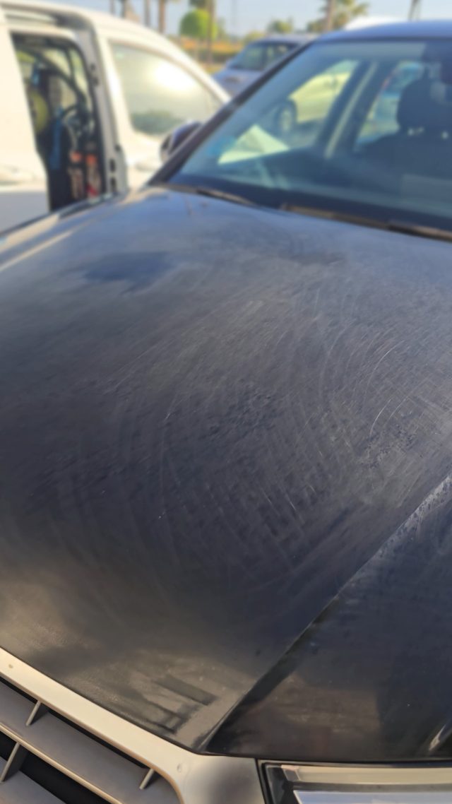 Black Audi bonnet, cloudy and blotchy from sun damage