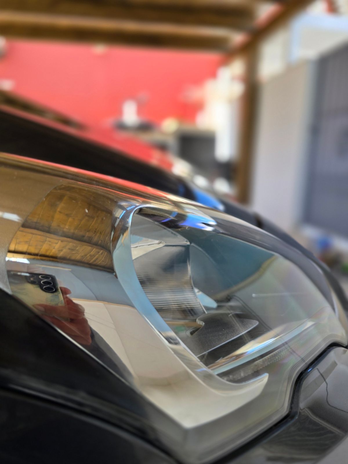 The same headlight after restoration, clear and glossy
