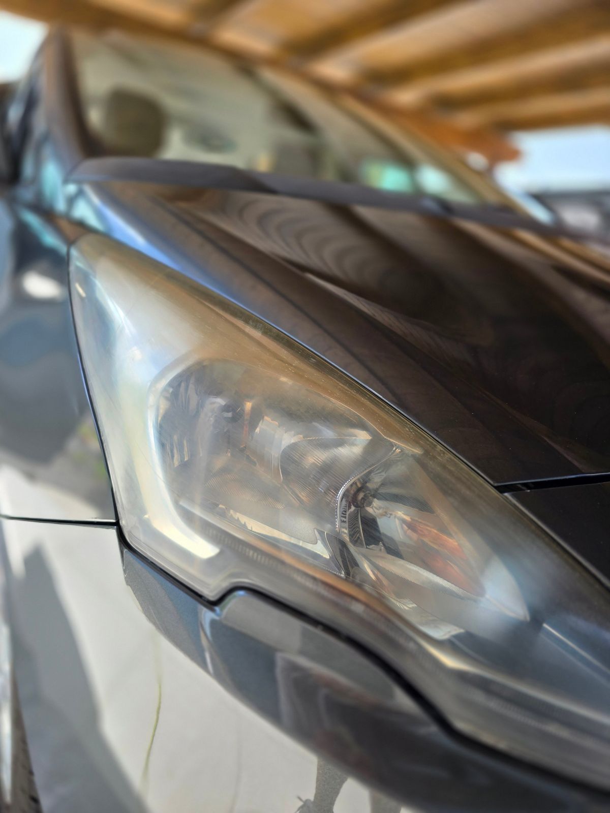 Yellowed, hazy headlight before restoration